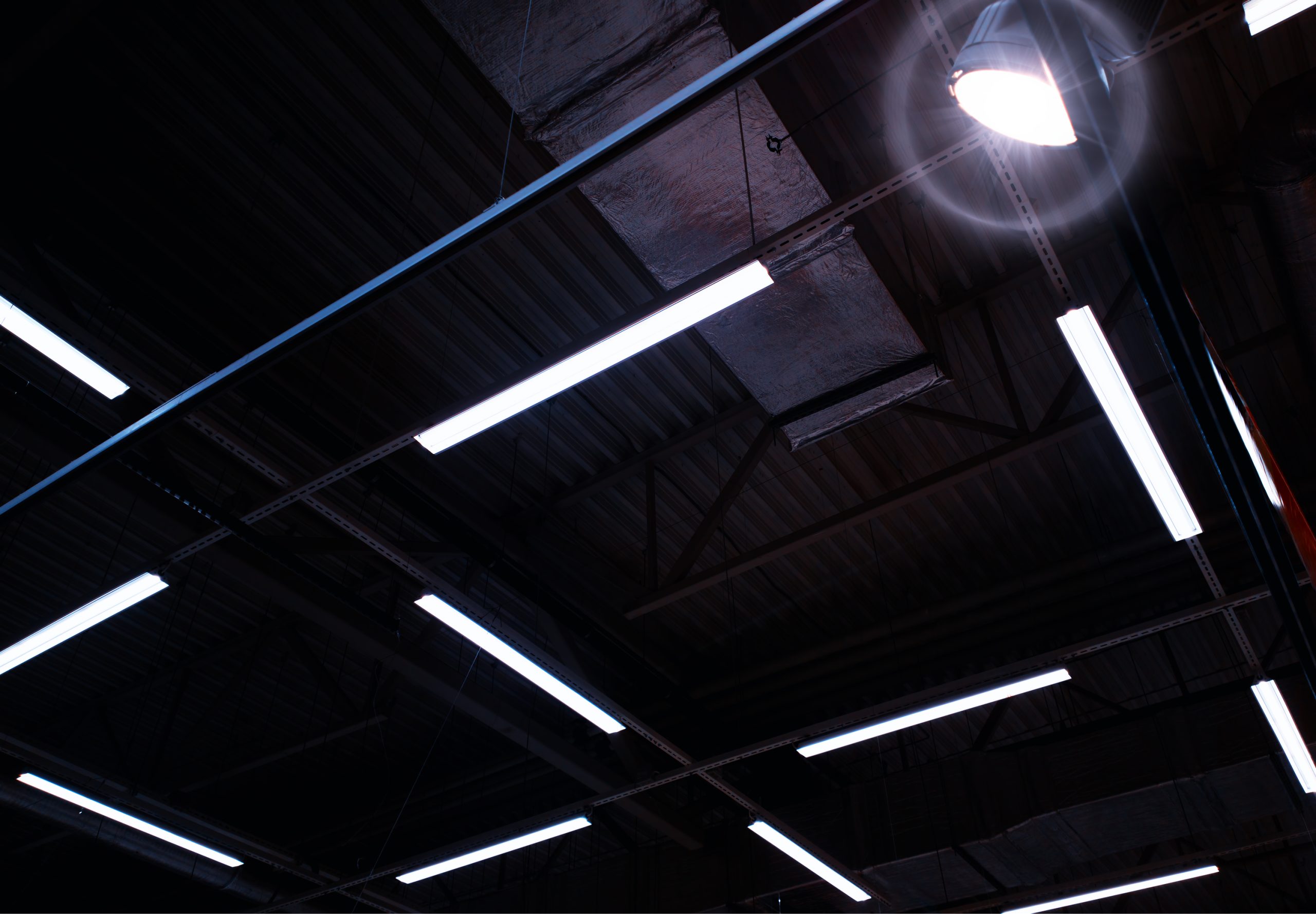 Dramatic lamp illuminating hangar ceiling